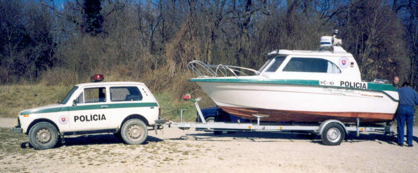 Police niva and boat